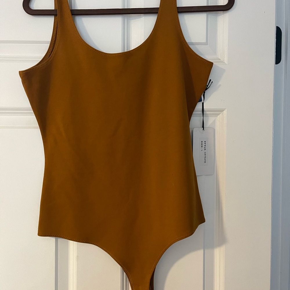 NWT RUST COLORED BODY SUIT LARGE